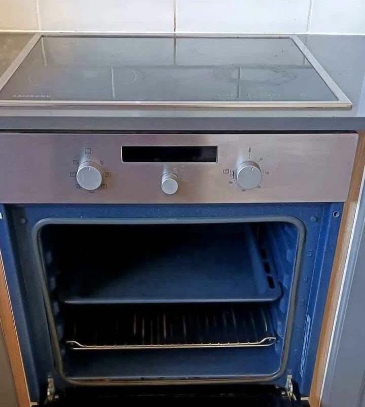 Built in electric oven and hob in a kitchen