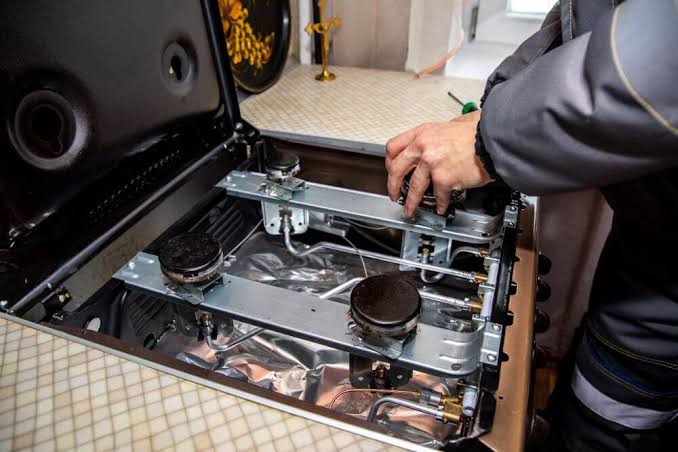 Gas stove burner servicing